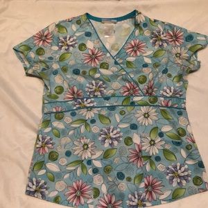 Two gently used XS scrub tops